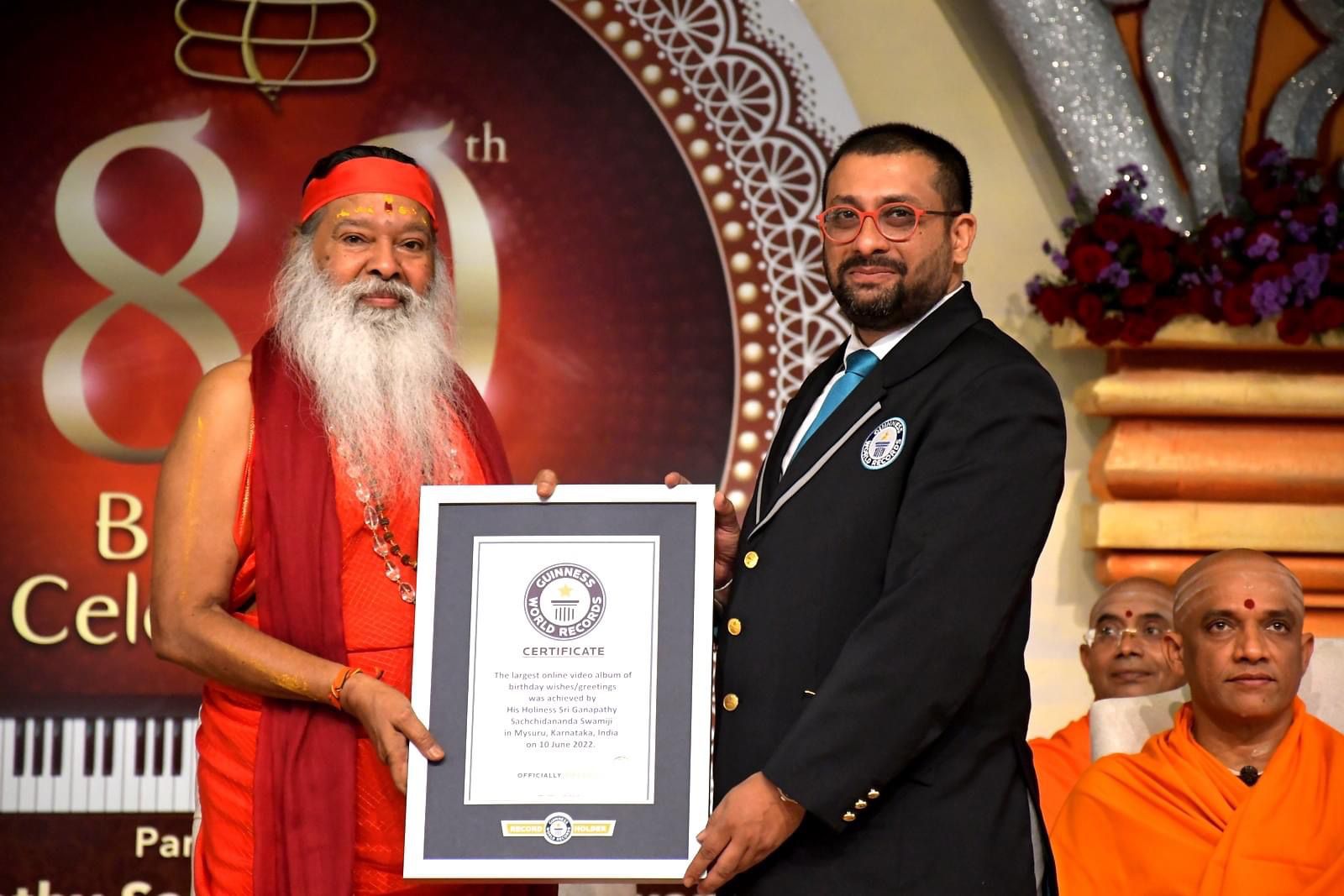 His Holiness Sri Swamiji receiving GWR certificate from Rishi Nath