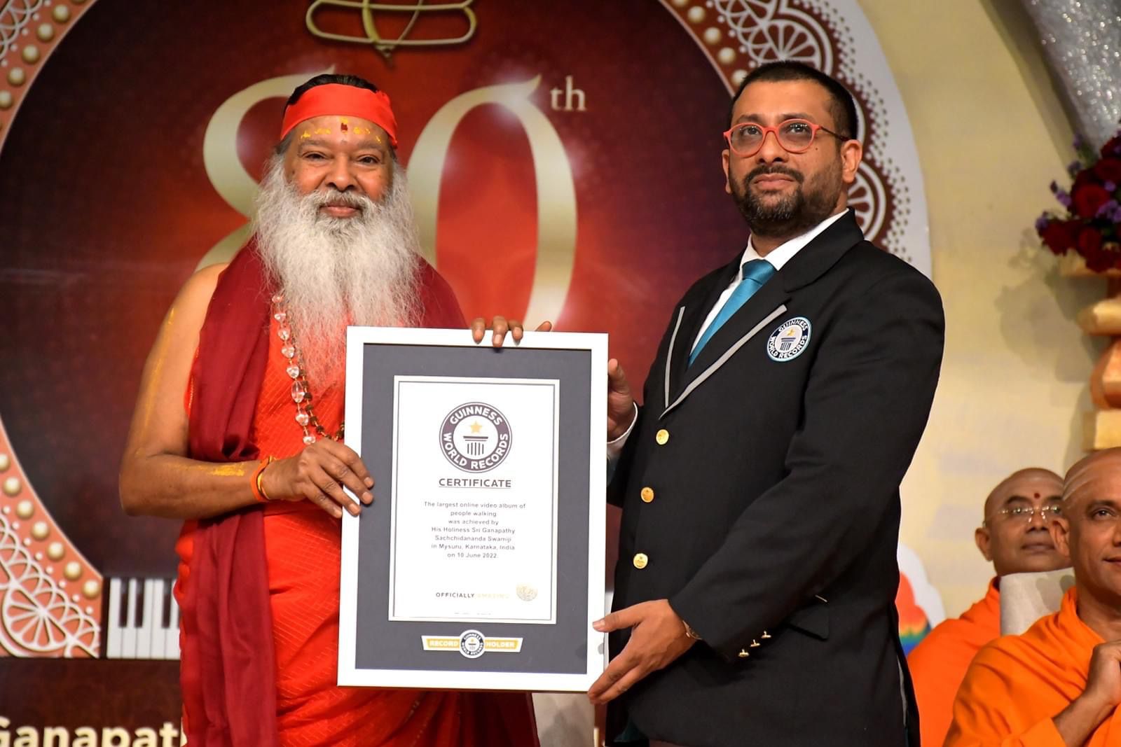 His Holiness Sri Swamiji receiving GWR certificate for Walkathon