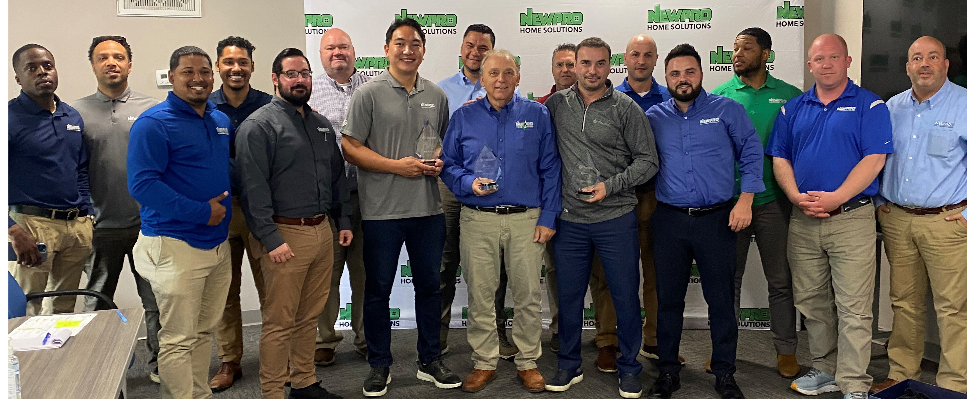 NEWPRO sales specialists were also recognized by Tando for exemplary sales and service: (center, left to right) Tony Yang, Rob Donadio and Enver Dibra display their awards.