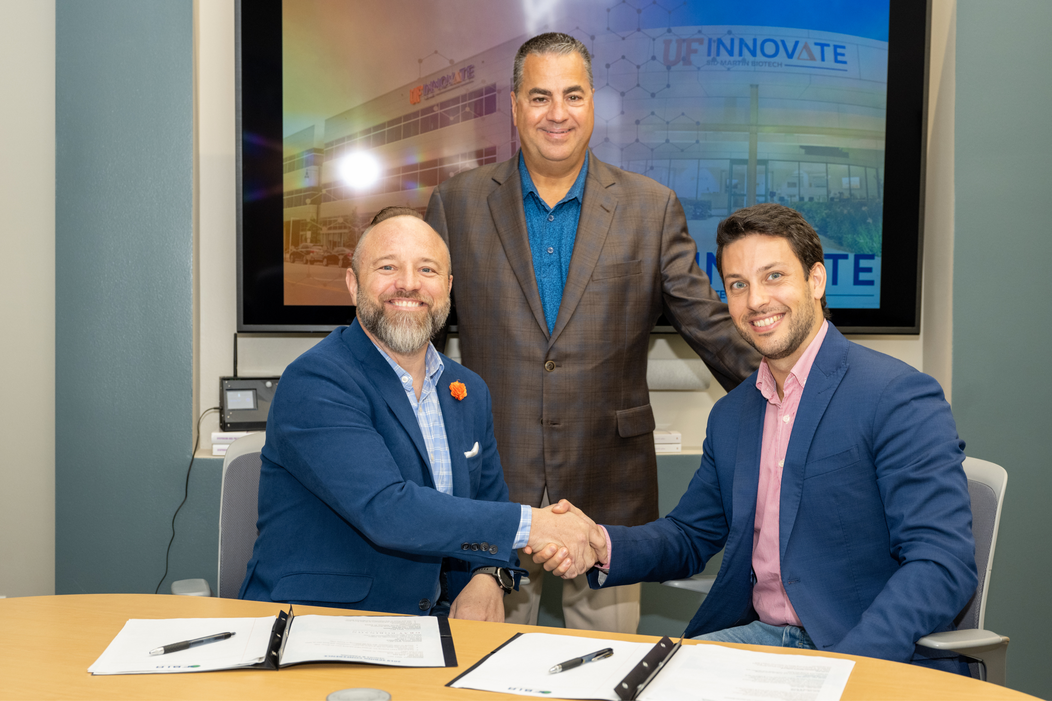 SATLANTIS’ and AgIntel’s team signing Memorandum of Understanding. From left, Matt Donovan of Agriculture Intelligence, Karl LaPan of UF Innovate | Accelerate, and Aitor Moriñigo of SATLANTIS.