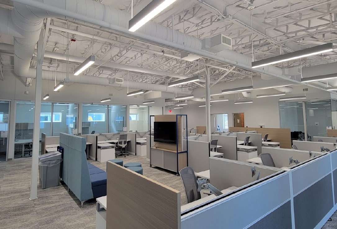 A view into the open office space with furniture complete and ready for employees to move in.