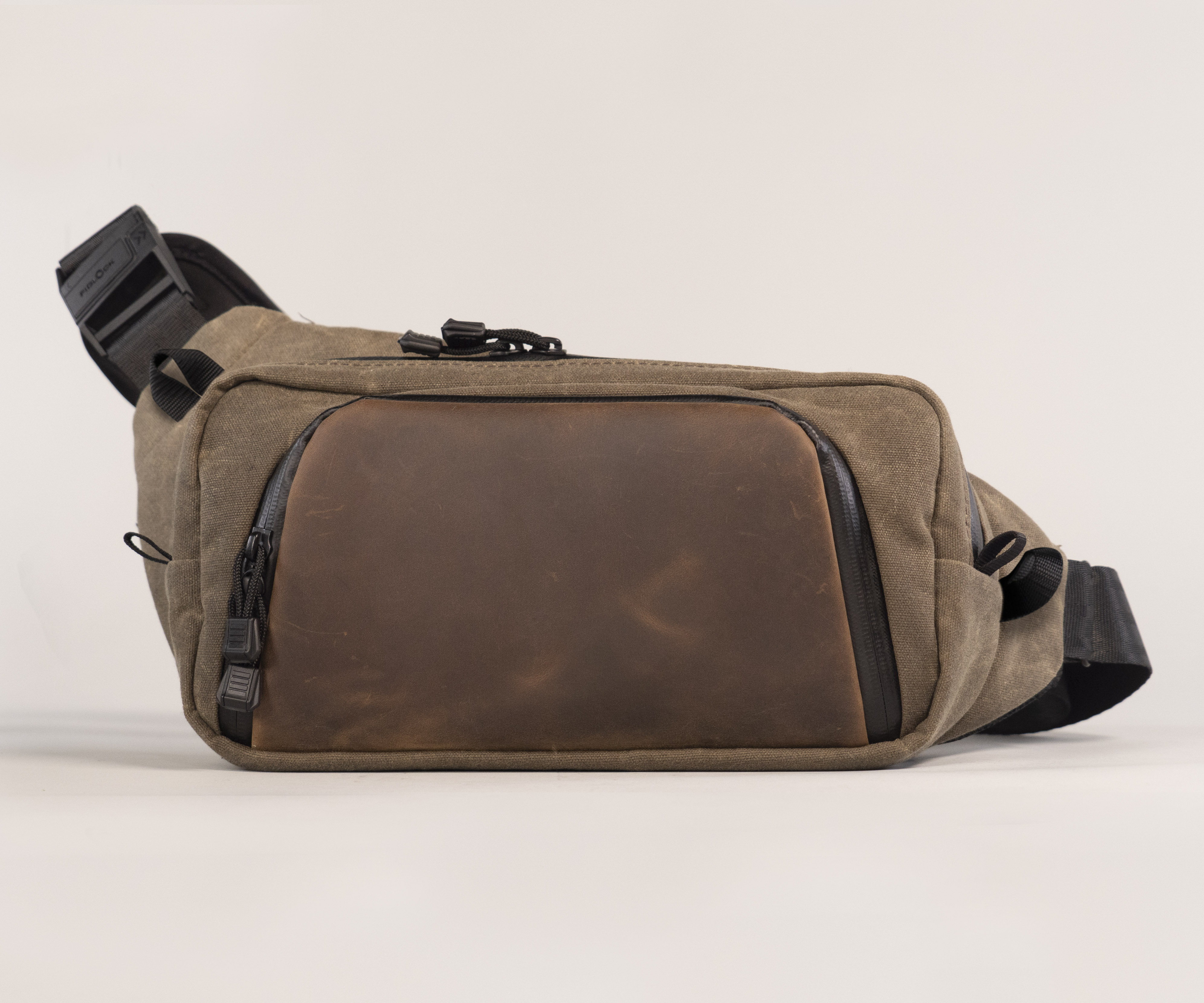 Moto Sling in waxed canvas and full-grain chocolate leather