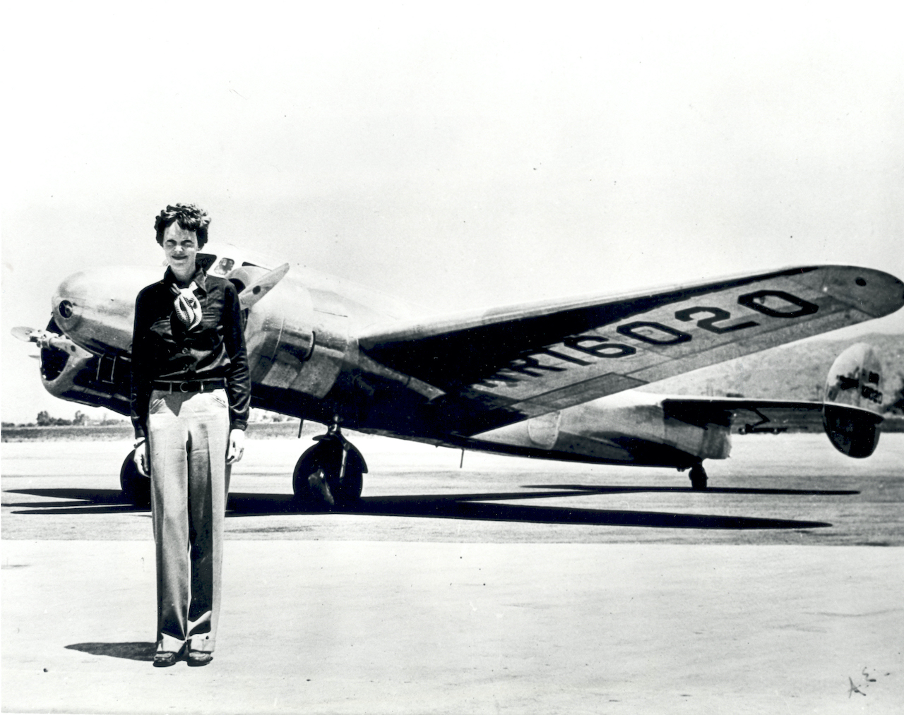 Amelia Earhart standing in front of her Lockheed Martin Electra 10-E.