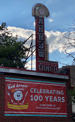 The Red Arrow Diner is continuing its year-long celebration of 100 years of operation in Manchester, NH with monthly discounted menu selections featured as Diner Dish of the Decade, promoting 100 fellow NH-based businesses, and offering commemorative merchandise, including a pewter collectible ornament.