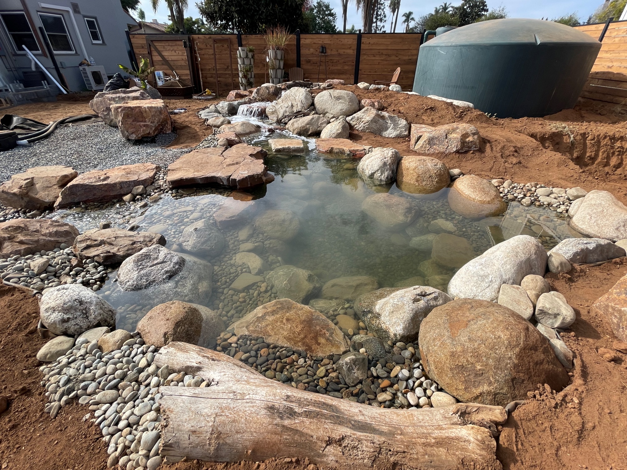 An Aquascape ecosystem pond pairs with a rainwater harvesting system to provide irrigation in drought-stricken California
