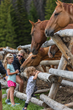 Kids love riding or just petting and feeding the many friendly horses at Wyoming’s remote Brooks Lake Lodge and Spa near Yellowstone.