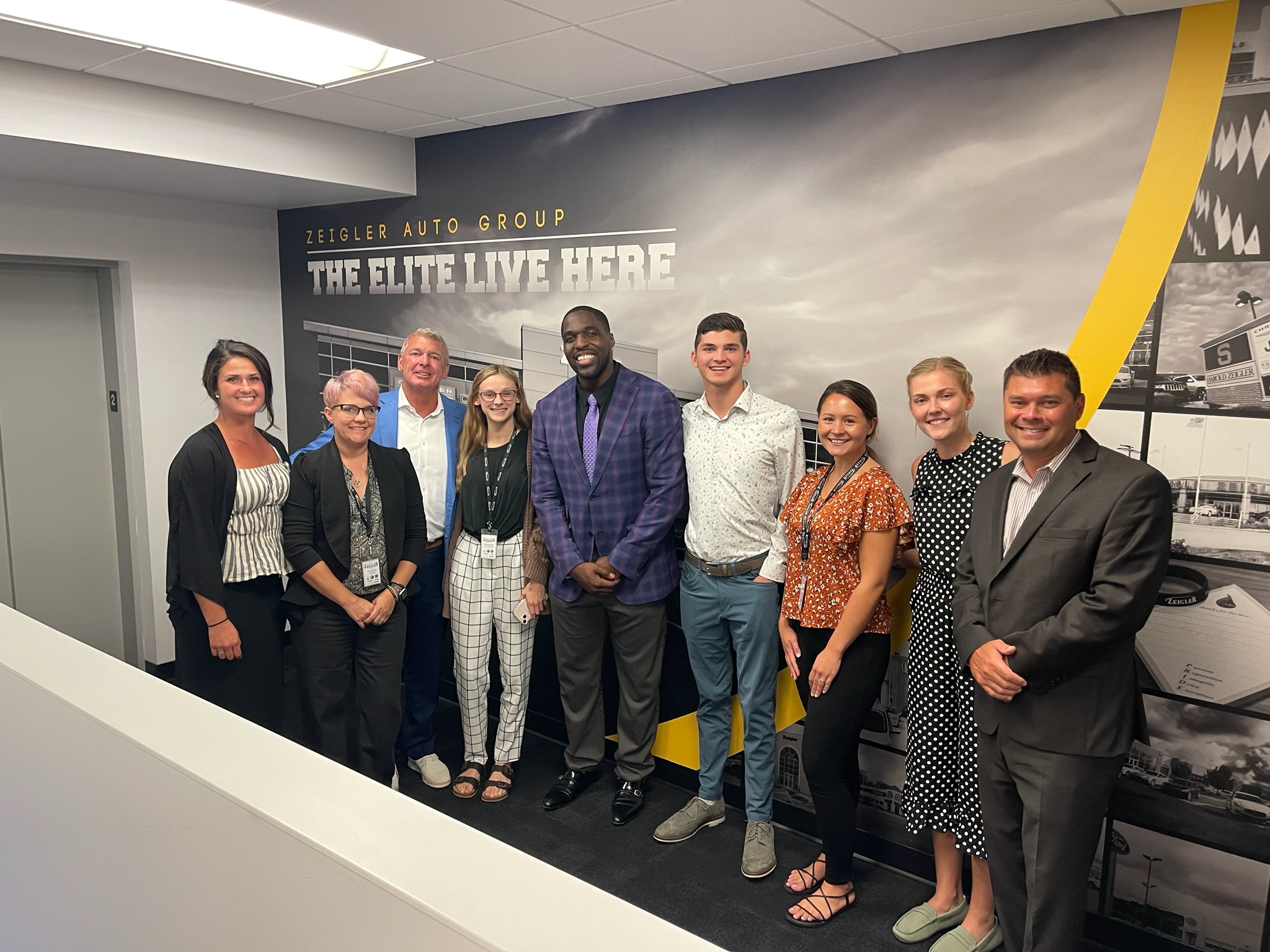 VP of NFL Players Association, ESPN Analyst and Author Sam Acho poses with TEAM ZEIGLER after his Zeigler University Guest Speaker Series session “What It Really Takes To Win”