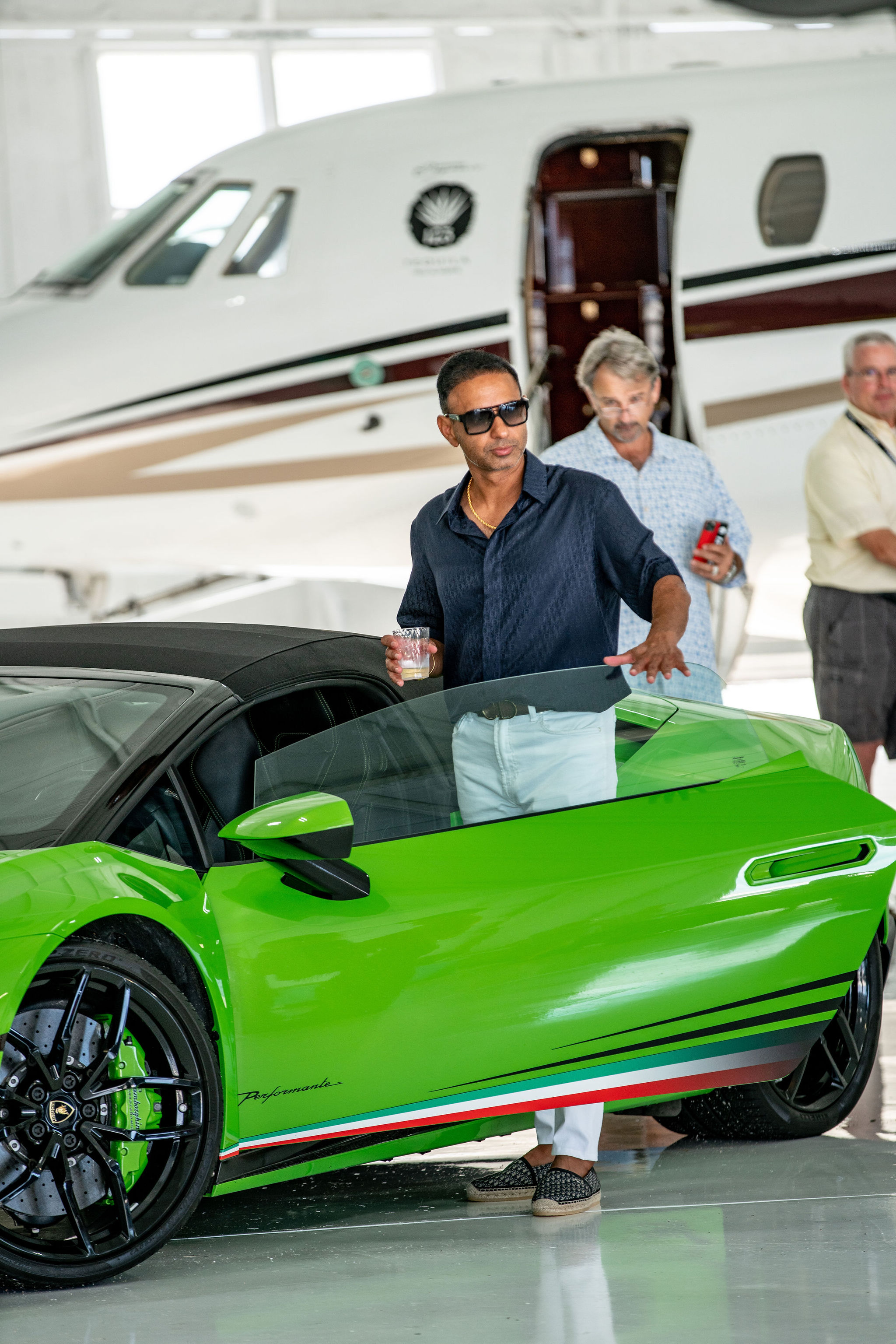 Visitors check out the "Fast Cars and Faster Jets" at the recent event held at RAI Jets.