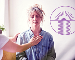 Woman in a clinic receiving supportive touch from a nurse at Beond's Mexico clinic.