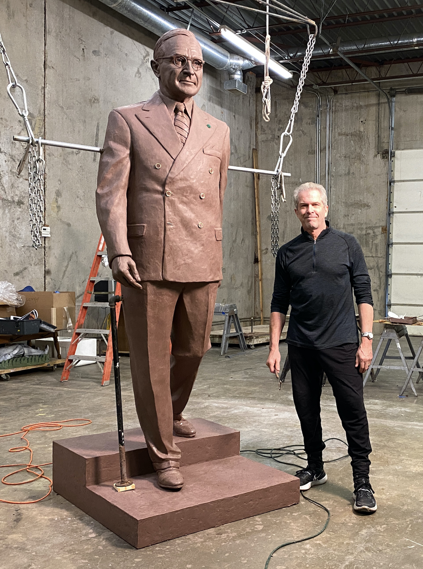 Sculptor Tom Corbin with clay statue of President Truman. The bronze statue will be installed in the Rotunda of the U.S. Capitol Building on Sept. 29.