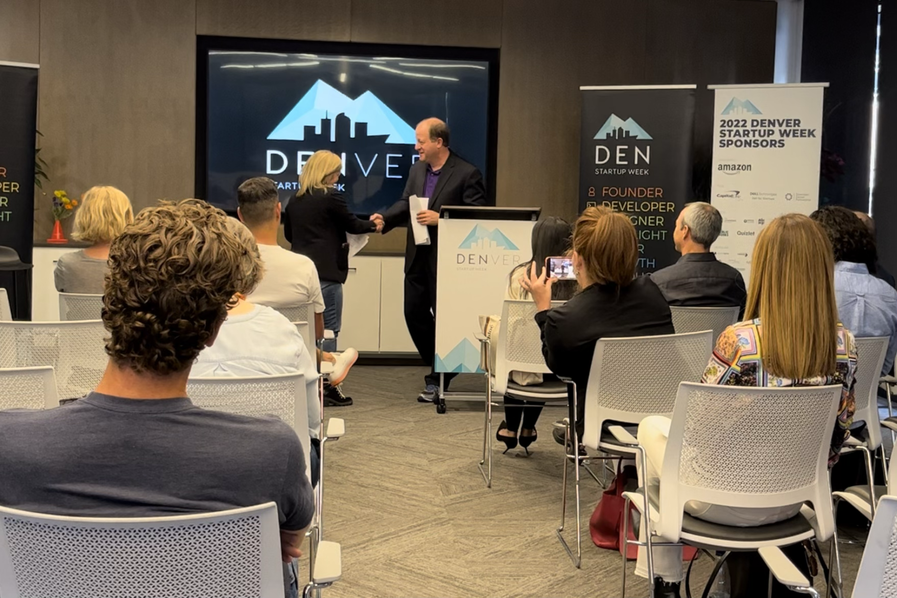 Governor Jared Polis with Denver Startup Week co-Founder Tammi Door just before he announced that Colorado would be the first State to accept cryptocurrency for tax payments on September 19, 2022.