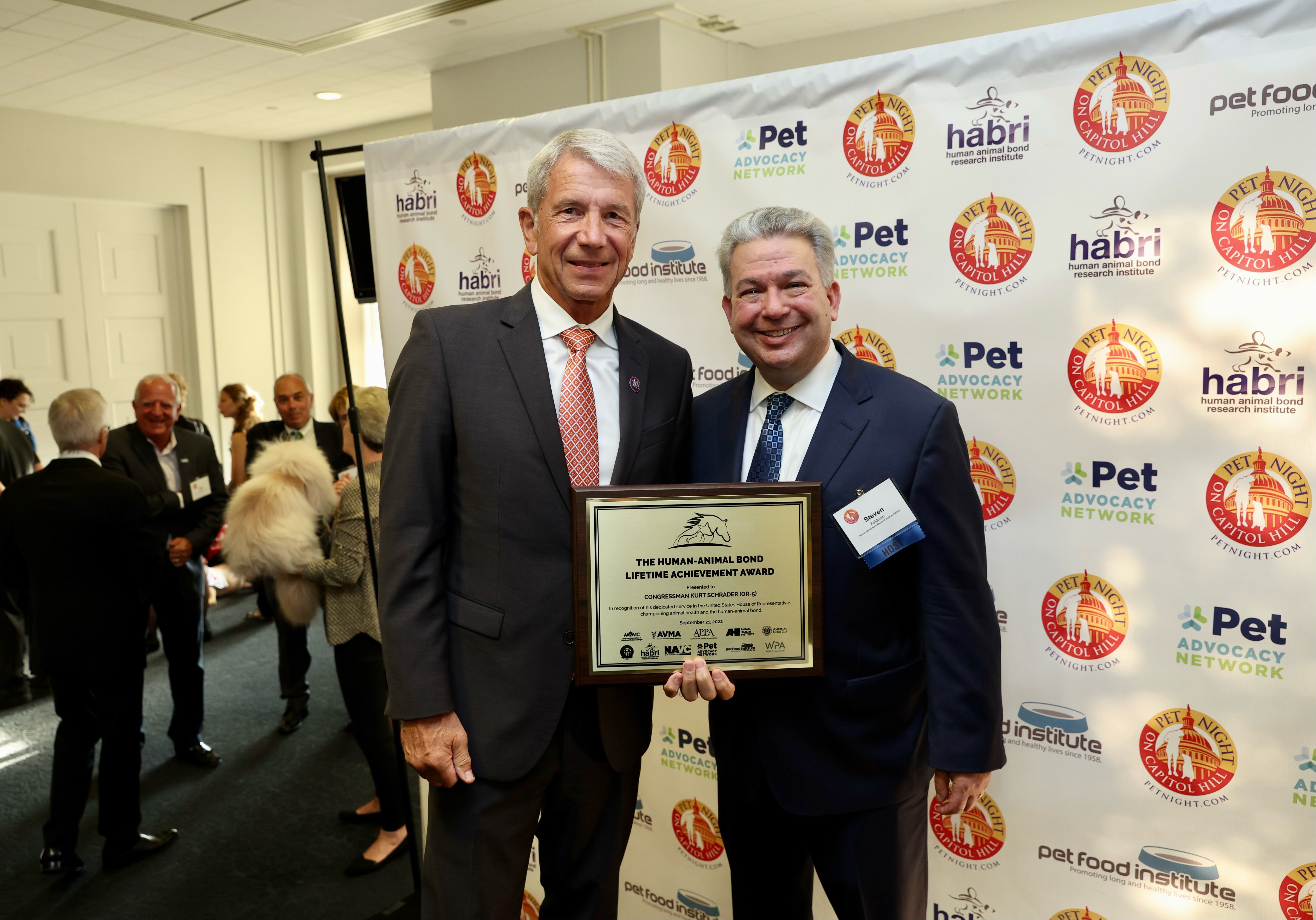 Congressman Kurt Schrader Accepting the Human Animal Bond Lifetime Achievement Award with HABRI President Steven Feldman.