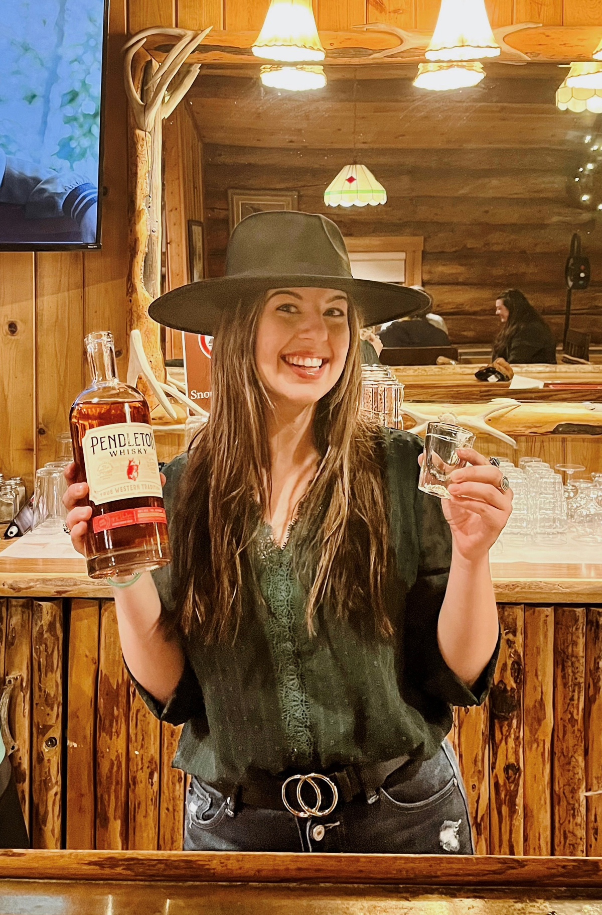 The onsite Cowboy Bar at Brooks Lake Lodge is the best place to belly up for top drinks and a convivial après atmosphere at the remote Wyoming guest ranch where casual luxury meets the Wild West.