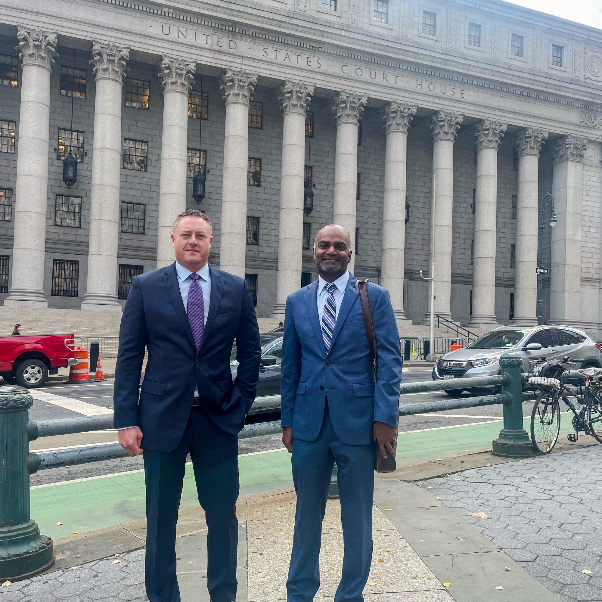 Attorneys Brett Leitner and Justin Varughese outside the US Court of Appeals after the argument