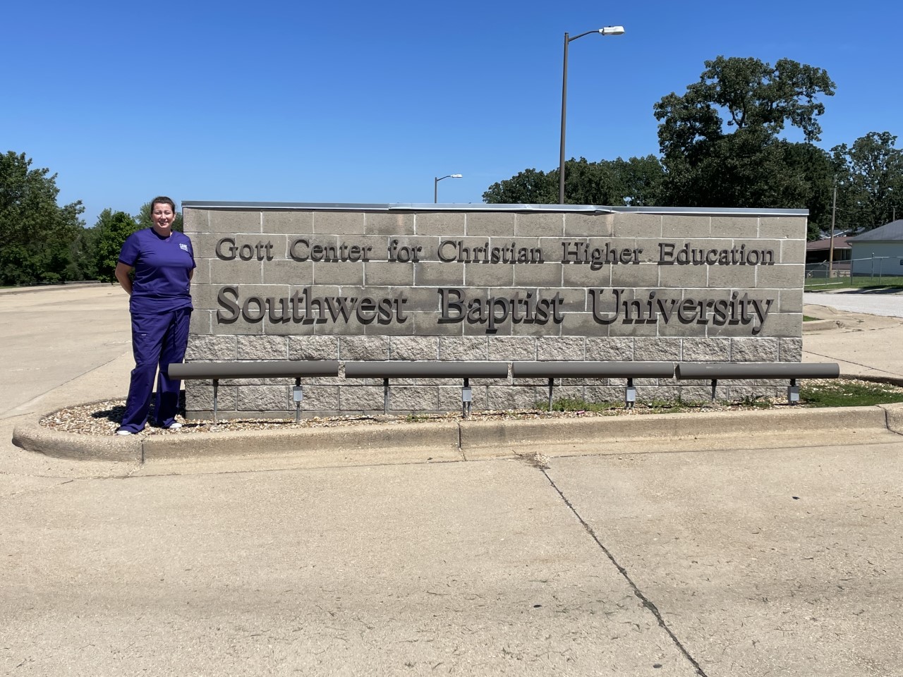 Marleana Coombs, recipient of the Doe Run Company Nursing Scholarship Fund, stands outside the Gott Center for Higher Education at Southwest Baptist University in Bolivar, Missouri.