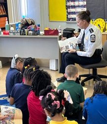 Jennifer Knight, Deputy Police Chief in Columbus, Ohio, reads to students.