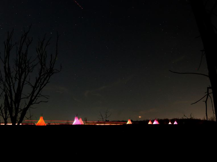 Oneida Indian Nation's Passage of Peace returns with a message of peace with 10 illuminated teepees. This year's installation to raise awareness about the harm inflicted by Indian Boarding Schools.