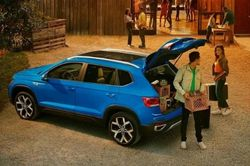 Family loading their 2023 Volkswagen Taos Cargo