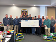 The Georgia Spa Gives Back program presents a $6,000 check to the Winder Fire Department and Chief Matt Whiting (left) for the WFD's Empty Stocking Drive.