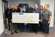 Representatives from the Georgia Spa Gives Back program present a $6,000 check to the Barrow County Sheriff's Office in support of Shop with a Hero.