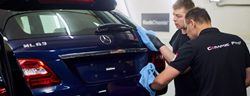 2 technicians servicing a Mercedes-Benz