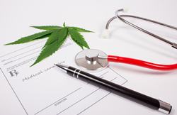 medical marijuana prescription tablet with a stethoscope and pen