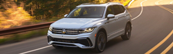 2023 VW Tiguan White driving on the highway