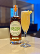 A photo of the featured cocktail, the Capital 80, along with a bottle of Borough Bourbon, distilled in Washington, DC