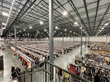 The interior of an existing Nuuly fulfillment center facility located in Philadelphia, Pennsylvania.