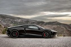 2023 McLaren GT Pioneer parked in a scenic area off-road