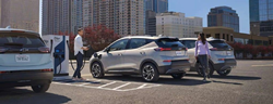 The 2023 Chevy Bolt parked at a public charging station.