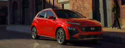 2023 Hyundai Kona Electric Red parked on the side of the road