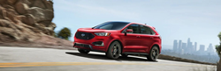 Used Ford Edge Red driving on the road
