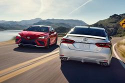 2023 Toyota Camry cars on a highway