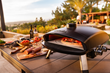 The Ora Pizza Oven is designed with a cast aluminum body and foldable legs making it both durable and portable.