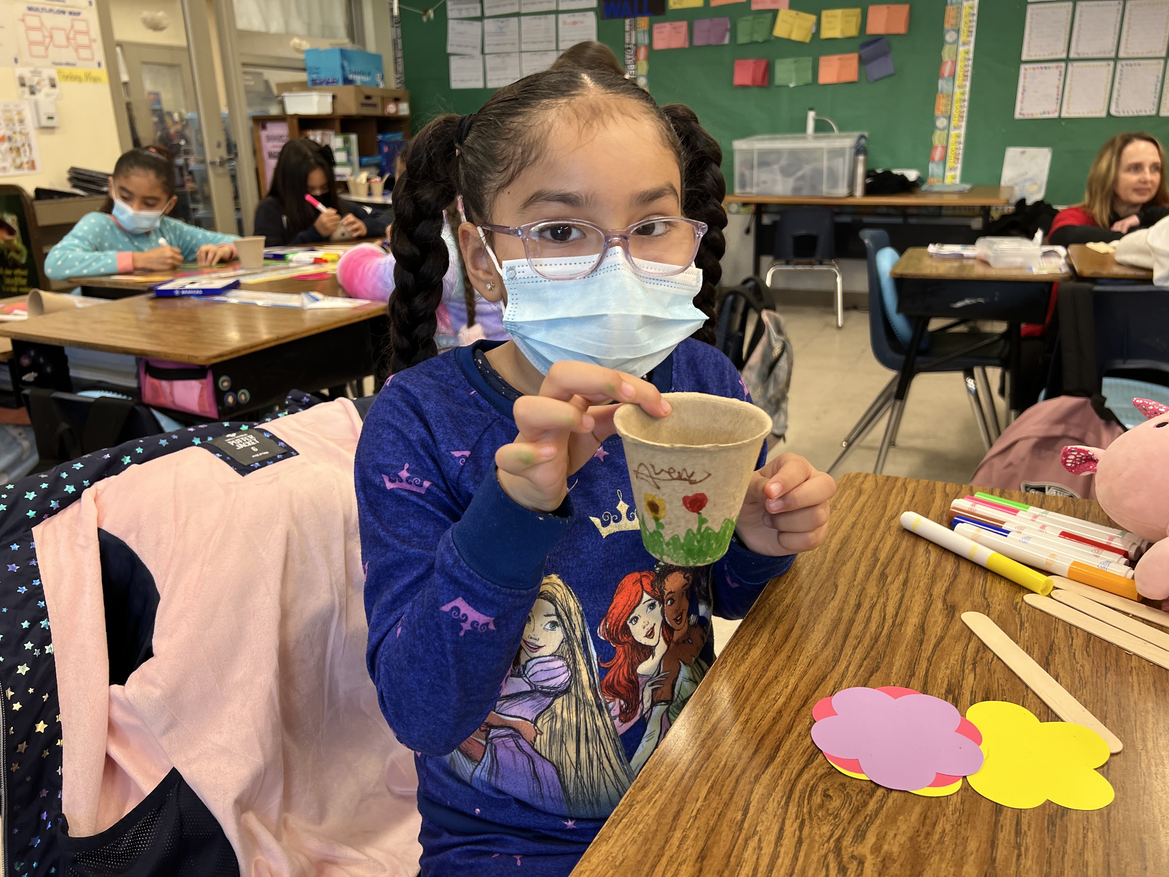 Student shares her pot she decorated after reading "Jayden's Impossible Garden."