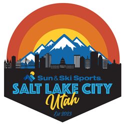 Sun and Ski sports is opening a new location in Salt Lake City mountains in the background with a orange and yellow sky behind the Salt Lake city downtown city scape in the foreground. 