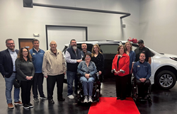 donors gather with the recipients to present a new wheelchair van