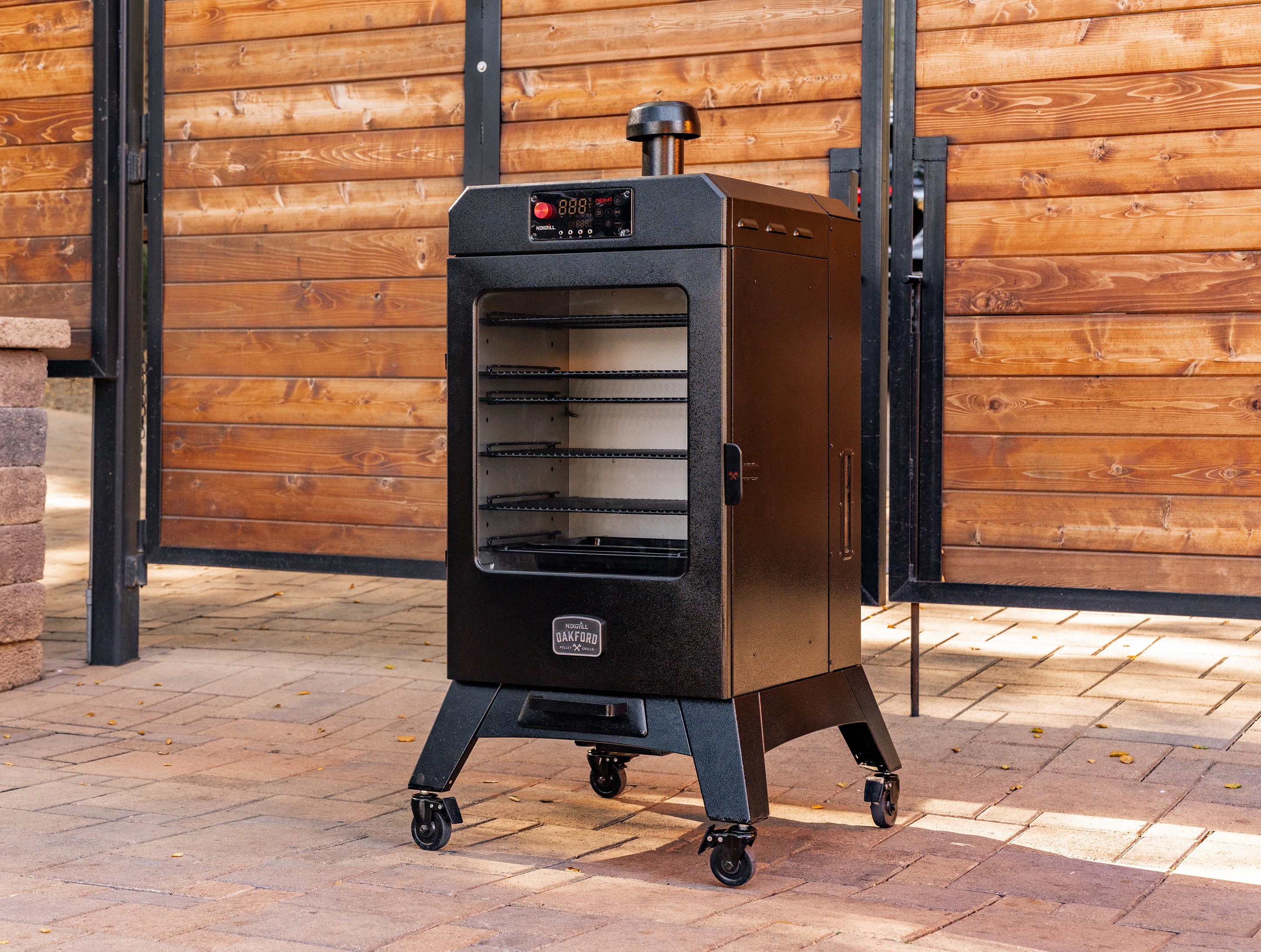The durable Vertical Pellet Smoker is built with hammer tone steel that’s been finished with a high-gloss black powder coating and a glass window on the smoker box.
