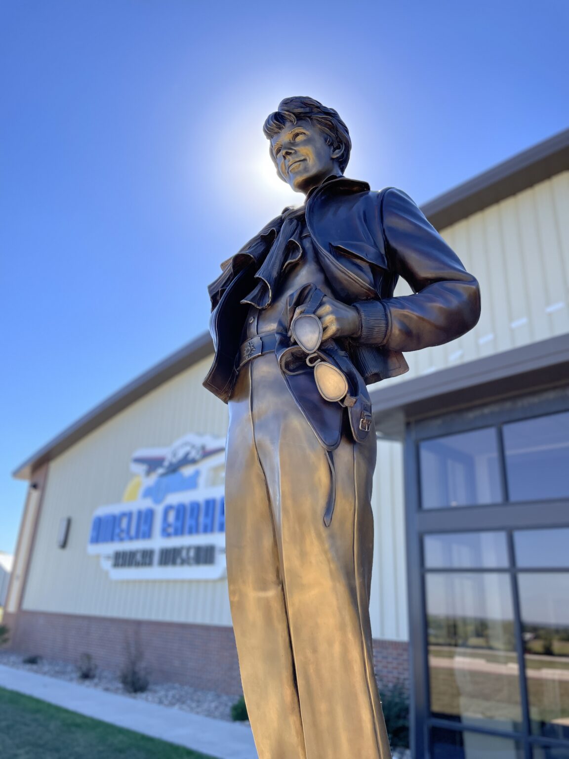 Bronze statue of Amelia Earhart greets visitors at the entrance of the Amelia Earhart Hangar Museum
