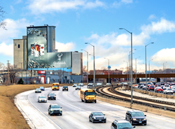 This 6,000 square foot static wallscape towers over the I-290 / Eisenhower Expressway, the western gateway to the city of Chicago.