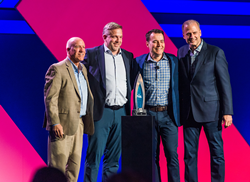 Inteva Products leaders Mark Bade, Marco vom Wege and Gerard Roose are seen here accepting the 2022 Supplier of the Year award from General Motors.