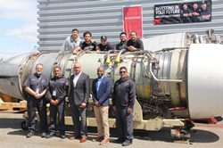 (Left to Right): Stephen Soel, Wilson Guerrero, Rakesh Patel, Roland Charles and Fredy Henao of Delta TechOps in front of engine donated to Vaughn College.