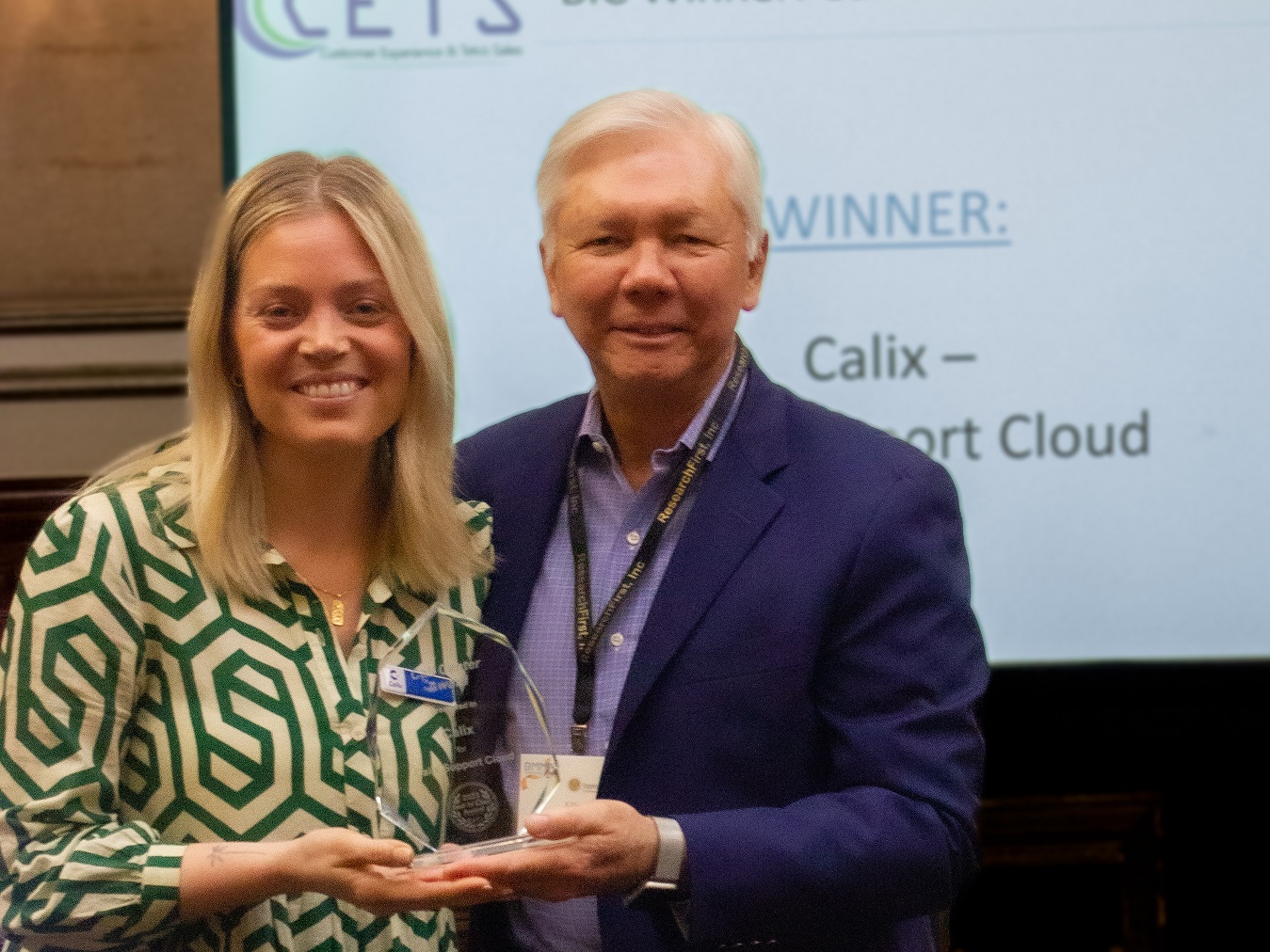 Tiffany Shurr, Area Vice President - Cloud Solutions of Calix (left) accepts the Call Center Award from Ellis Hill, President of ResearchFirst (right).