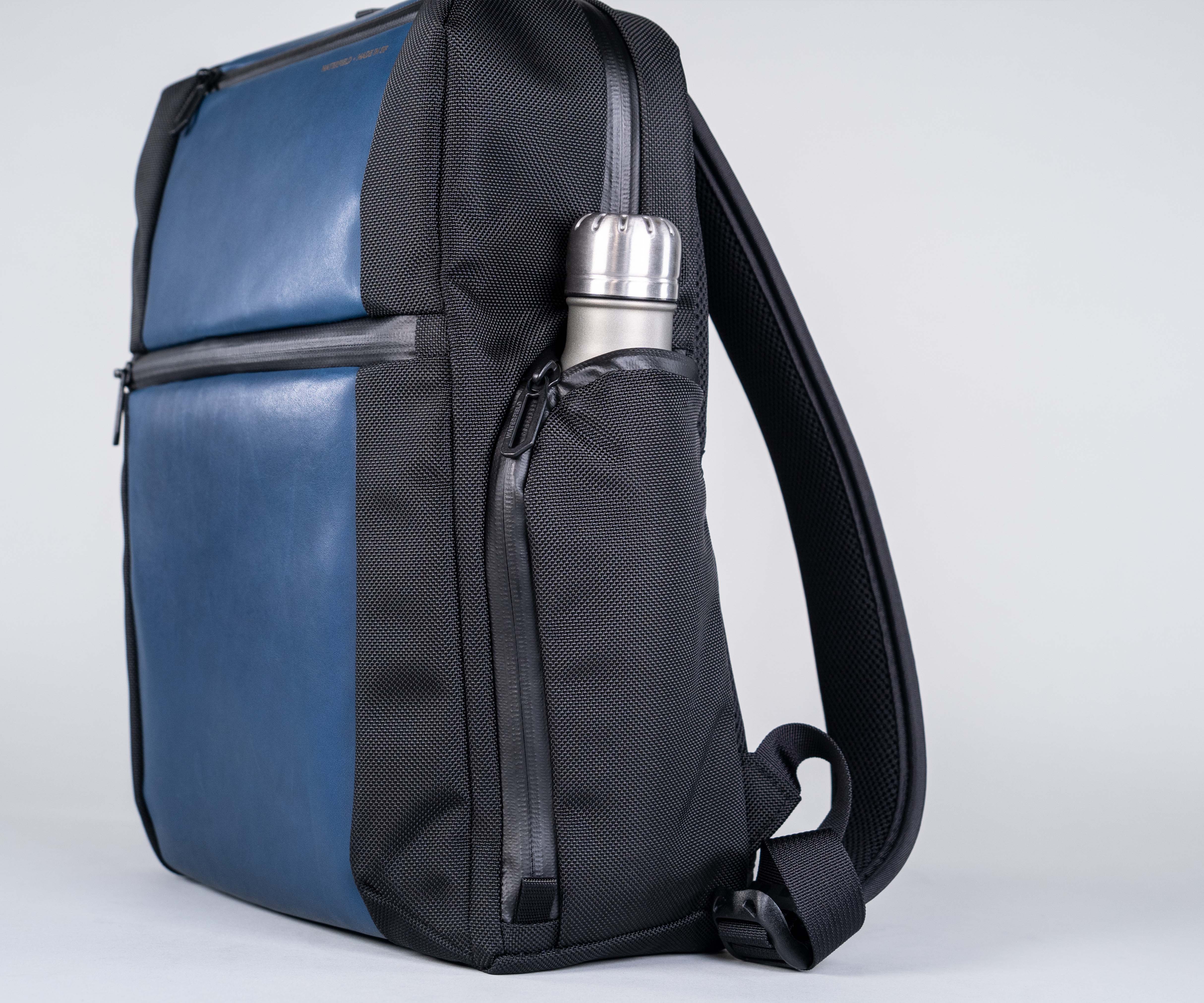 Zippered water bottle pocket holds various sizes and uses interior space to keep bag compact.