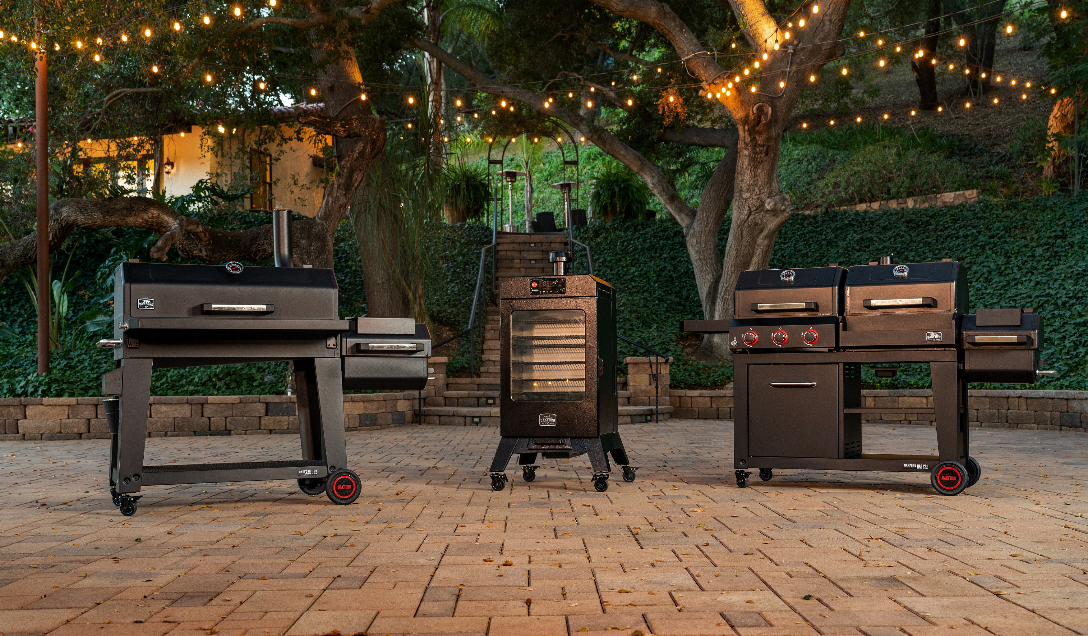 From left to right, Nexgrill’s Oakford Reverse Flow Offset Smoker, Oakford Vertical Pellet Smoker, and Oakford Pro Gas Grill/Smoker Combo.