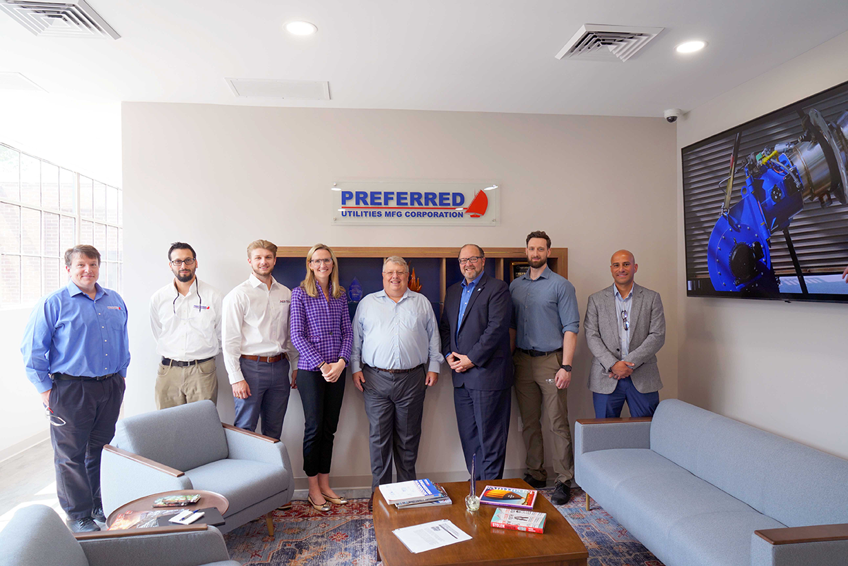 Preferred Utilities Manufacturing executives with Alexandra Daum (4th from left) and Paul Lavoie (3rd from right)
