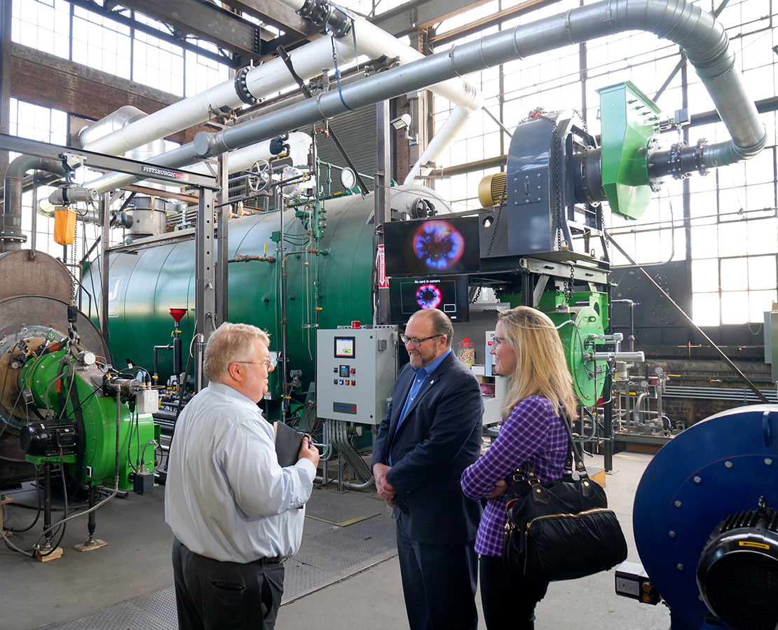Preferred Utilities President David Bohn (left) with Paul Lavoie (center) and Alexandra Daum (right)