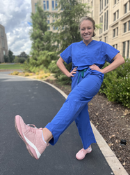 Stanford medical student, Ella Eastin wearing scrubs and a pink pair of Nurse Mates sneakers.