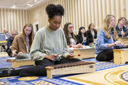 Young music educators using Orff instruments at professional development session at NAfME 2022 conference